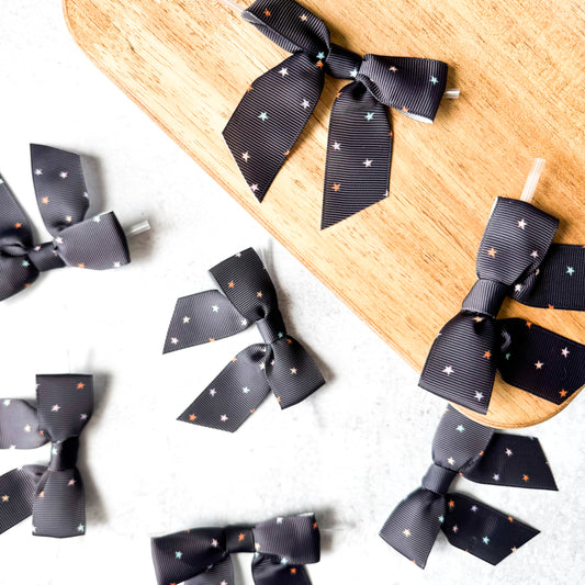 black halloween starry pre-tied 4" grosgrain bows with clear twist ties - set of 25