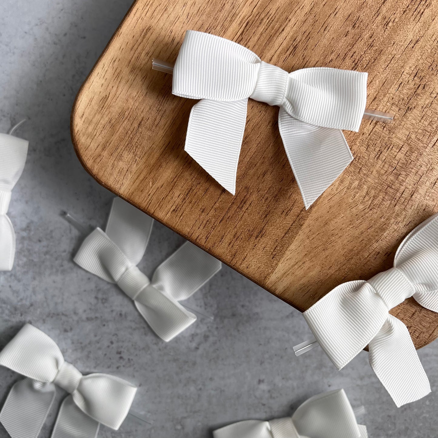 off white pre-tied 4" grosgrain bows with clear twist ties - set of 25