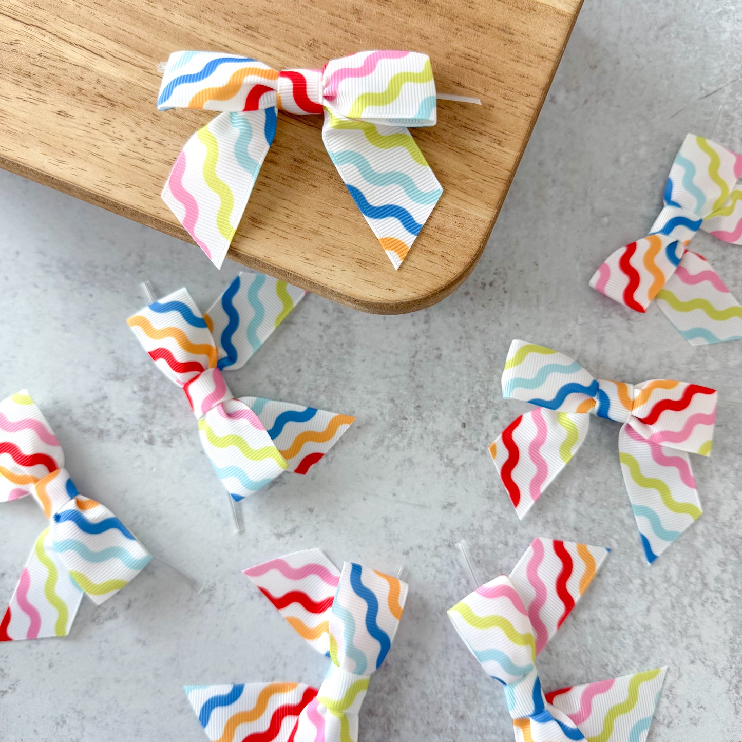 wavy multicolor pre-tied 4" grosgrain bows with clear twist ties - set of 25