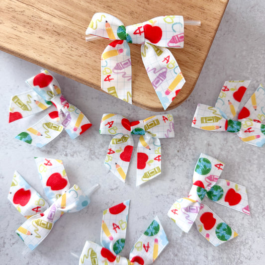 white doodles pre-tied 4" grosgrain bows with clear twist ties - set of 25