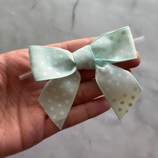 pre-tied 4" grosgrain bows with clear twist ties - light turquoise with white polka dots - set of 25