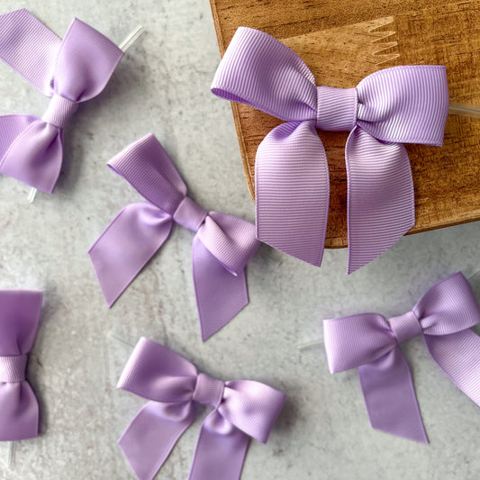 light purple pre-tied 4" grosgrain bows with clear twist ties - set of 25