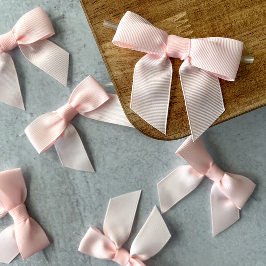 light pink pre-tied 4" grosgrain bows with clear twist ties - set of 25